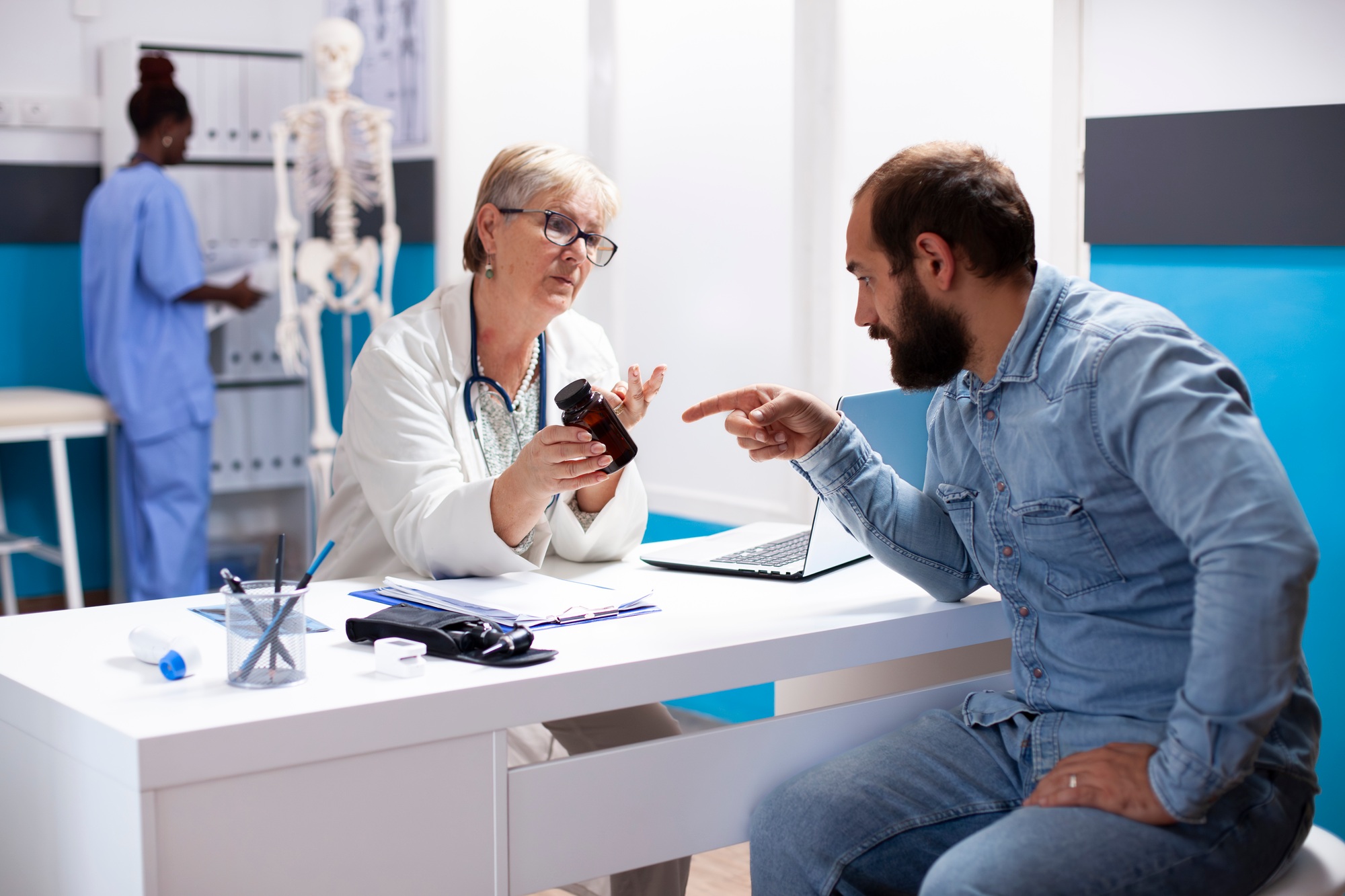 Doctor guides patient on medication