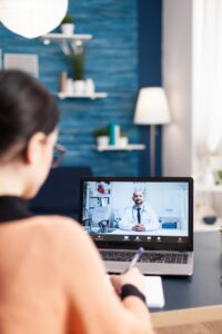 Student having online videcall conference with physician doctor